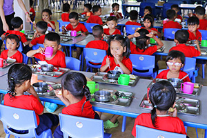 JPA Image Gallery - Preschool students having lunch in the cafeteria - Jay Pritzker Academy, Siem Reap, Cambodia