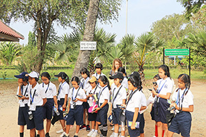 JPA Image Gallery - Middle school students listening to audio guide on an excursion near Phnom Penh - Jay Pritzker Academy, Siem Reap, Cambodia