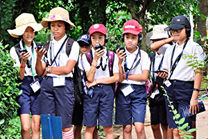 JPA Image Gallery - Students listen to an audio tour in Phnom Penh - Jay Pritzker Academy, Siem Reap, Cambodia
