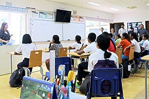 JPA Image Gallery - Parents and high school students listen to a teacher presentation - Jay Pritzker Academy, Siem Reap, Cambodia