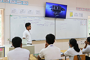 JPA Image Gallery - High school student presenting for class - Jay Pritzker Academy, Siem Reap, Cambodia