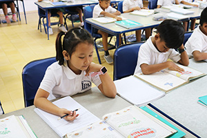 JPA Image Gallery - Primary students at their desks doing classwork - Jay Pritzker Academy, Siem Reap, Cambodia