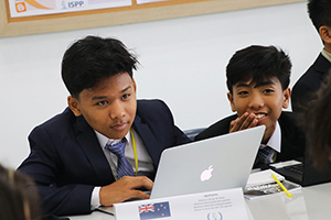 JPA Image Gallery - 2 male high school students participating at model UN - Jay Pritzker Academy, Siem Reap, Cambodia