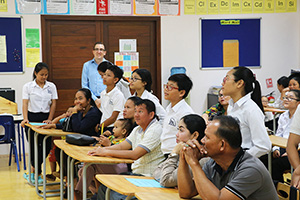 JPA Image Gallery - Parents and students listening to a presentation - Jay Pritzker Academy, Siem Reap, Cambodia