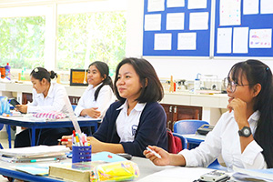 JPA Image Gallery - High school students at desks in class - Jay Pritzker Academy, Siem Reap, Cambodia