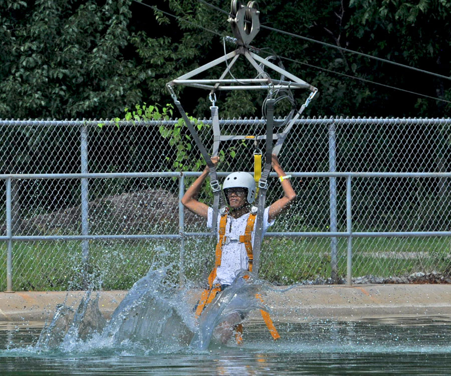 JPA student Savong ’18 on a Zip Line attending summer camp at the US Space and Rocket Center at Huntsville, Alabama. Jay Pritzker Academy, Siem Reap, Cambodia. Jay-Pritzker-Academy-Siem-Reap-Cambodia