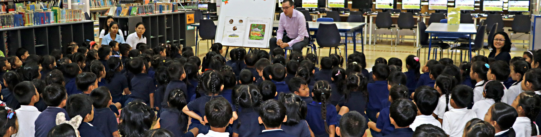 JPA students listening to a JPA Teacher read a story in the library for Book Week. Book: The Gruffalo. Jay Pritzker Academy, Siem Reap, Cambodia. Jay-Pritzker-Academy-Siem-Reap-Cambodia.