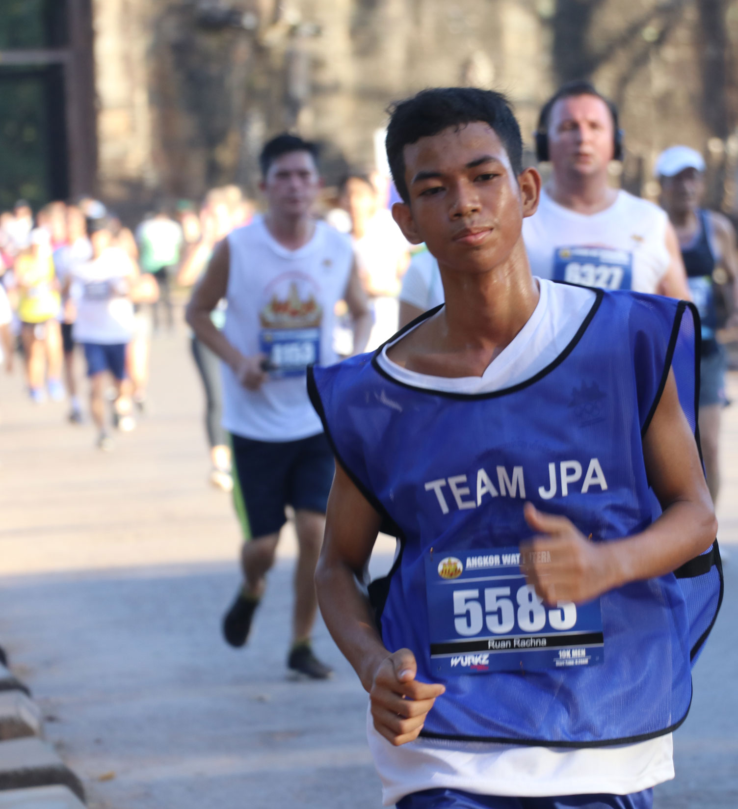 JPA student Rachna running in the Angkor Wat Half Marathon. Jay Pritzker Academy, Siem Reap, Cambodia. Jay-Pritzker-Academy-Siem-Reap-Cambodia.