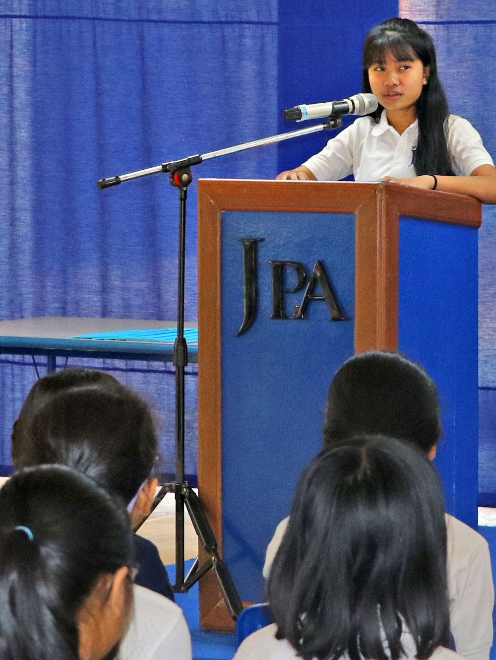 JPA student Sengly ’23 speaking eloquently about facing her fears when public speaking - Honors Assembly. Jay Pritzker Academy, Siem Reap, Cambodia. Jay-Pritzker-Academy-Siem-Reap-Cambodia.