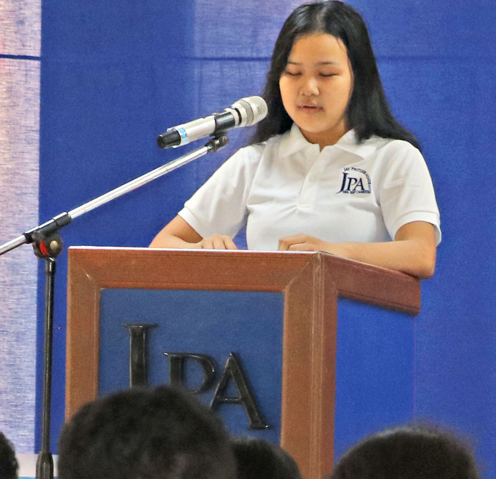 JPA student Ellen ’22 sharing her experiences and thoughts about the negative impact of bullying and ways to combat it - Honors Assembly. Jay Pritzker Academy, Siem Reap, Cambodia. Jay-Pritzker-Academy-Siem-Reap-Cambodia.